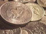 Close-Up of American Silver Dollar Coin with Eagle on its Face with Other Coins Photographic Print Close-Up of American Silver Dollar Coin with Eagle on its Face with Other Coins Photographic Print