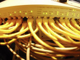Yellow Network Power Plugs Connected to Computer Machinery Photographic Print