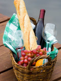 Picnic Basket with Glassware and Picnic Foods Including Bread and Grapes with Wine Photographic Print