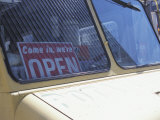 Come in We'Re Open Sign on Windshield of Parked Delivery Truck Photographic Print