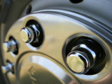 Close Up of Metal Lug Nuts on Car Tire Photographic Print