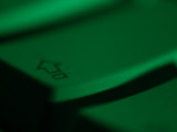 Green Tinted Return Button on a Computer Keyboard Photographic Print