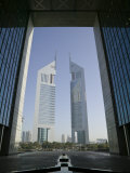 Emirates Towers Through Dubai International Financial Center Arch, Sheikh Zayed Road, Dubai, UAE Photographic Print by Walter Bibikow