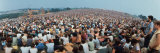Seated Crowd Listening to Musicians Perform at Woodstock Music Festival Lámina fotográfica por John Dominis