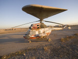 Iraqi Helicopter Sits on the Flight Deck Abandoned at Camp Warhorse Lámina fotográfica por Stocktrek Images