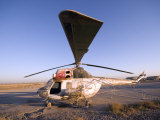 Iraqi Helicopter Sits on the Flight Deck Abandoned at Camp Warhorse Lámina fotográfica por Stocktrek Images