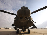AH-64 Helicopter Sits on the Flight Line at Camp Speicher Photographic Print by Stocktrek Images 