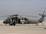 UH-60 Blackhawk Medivac Helicopter Refuels at Camp Warhorse after a Mission Lámina fotográfica por Stocktrek Images