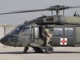 UH-60 Blackhawk Medivac Helicopter Refuels at Camp Warhorse after a Mission Photographic Print by Stocktrek Images 