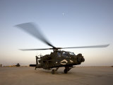 AH-64 Apache Gets Ready for Take Off at Camp Speicher Photographic Print by Stocktrek Images 
