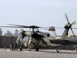UH-60 Blackhawk Medivac Helicopter Refuels at Camp Warhorse after a Mission Lámina fotográfica por Stocktrek Images