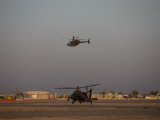 AH-64 Apache Helicopter Waits for an OH-58 Kiowa to Clear His Flight Space Photographic Print by Stocktrek Images 