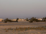 Pair of AH-64 Apache Helicopters Prepare for Takeoff Photographic Print by Stocktrek Images 