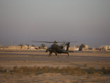 AH-64 Apache Waits for Clearance from the Flight Tower on Camp Speicher Photographic Print by Stocktrek Images 