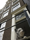 Schnauzer Dog Sitting on Stoop, Amsterdam, Holland Photographie par Keenpress 
