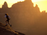 Woman Runs Up a Red Rock Slope, Sedona, Arizona, United States Photographic Print by Kate Thompson
