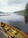 Canoe Floats Next to a Dock, Sebago Lake, Maine Photographie par Skip Brown