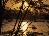 Water Taxi Ferries Passengers across River at Sunrise, Rio Madre de Dios, Puerto Maldonado, Peru Photographic Print by Maria Stenzel