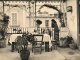 Woman Looking Out onto the Terrace of a Restaurant Lámina fotográfica por Ludovico Pacho