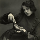 Portrait of Marion Wulz, as She Observes the Statue of Buddha in Her Hands Photographic Print by Carlo Wulz