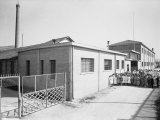 Workers Outside the Factory of Latex Products H.A.T.U. Bologna Photographic Print by A. Villani