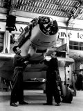 Two Technicians are Inspecting the Airplane under Construction Inside a Caproni Hangar Photographic Print by A. Villani