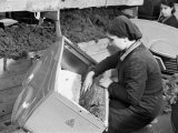 Female Worker Fixing the Padding of a Baby Carriage, Giordani Company Factory Photographic Print by A. Villani Female Worker Fixing the Padding of a Baby Carriage, Giordani Company Factory Photographic Print by A. Villani