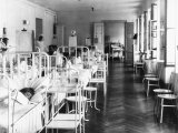 Room in the Pediatrics Hospital Ward with Patients and Medical Personnel Photographic Print by Carlo Wulz