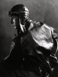 Half-Length Portrait in Profile of a Motor Cyclist with Leather Jacket and Helmet Photographic Print by Carlo Wulz