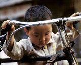Little Boy with Bike, China Plakater av Philippe Body