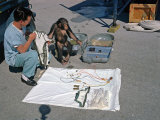 Ham the Chimpanzee and Technician Go over Equipment in Preparation for Launch, January 23, 1961 Photo