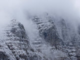 Cloud-draped mountain peaks at Logan Pass Photographic Print by Michael Melford