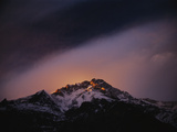 At sunset, wind scours the upper reaches of Nanga Parbat Photographic Print by Tommy Heinrich