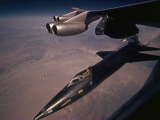 An X-15 rocket plane drops free of a B-52 Photographic Print by Dean Conger