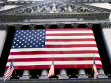 The facade of the New York Stock Exchange draped in the American Flag Photographic Print by Justin Guariglia