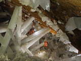 Cavers climbing a web of gypsum crystals Photographic Print by Carsten Peter