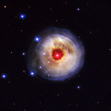 Radiation from a stellar burst ricochets off dust particles Photographie par Esa And Nasa