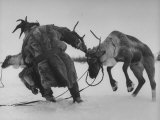 Lapp Struggling to Harness One of His Reindeer Photographic Print by Mark Kauffman