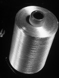 Closeup of a Spool of Coned Rayon Yarn at the Industrial Rayon Corp. Factory Lámina fotográfica por Margaret Bourke-White