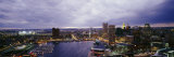 Buildings Lit Up at Dusk, Baltimore, Maryland, USA Photographic Print by  Panoramic Images