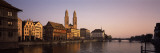 Buildings at the Waterfront, Grossmunster Cathedral, Limmat River, Zurich, Switzerland Photographic Print by  Panoramic Images