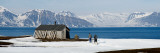 Two Hikers Standing on the Beach Near a Hunting Cabin, Bellsund, Spitsbergen, Svalbard Islands Photographic Print by  Panoramic Images