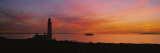 Silhouette of a Lighthouse at Sunset, Scotland Photographic Print by Panoramic Images