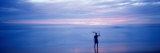 Silhouette of a Man Carrying a Surfboard over His Head on the Beach, Costa Rica Photographic Print by  Panoramic Images