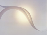 Two White Fabric Streamers Drifting in Pale Grey Sky with Strong Backlight Photographic Print