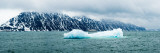 Iceberg in the Sea with a Ship in the Background, Spitsbergen, Svalbard Islands, Norway Lámina fotográfica por Panoramic Images