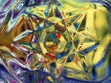 Kaleidoscopic Star Pushing Through Yellow Water with Blue Edges Photographic Print