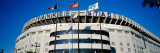 Flags in Front of a Stadium, Yankee Stadium, New York City, New York, USA Fotografie-Druck von  Panoramic Images