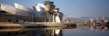 Reflection of a Museum on Water, Guggenheim Musuem, Bilbao, Spain Photographic Print by  Panoramic Images