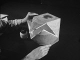 Multi-Sided Paper Globe Being Constructed from Do-It-Yourself Kit Lámina fotográfica